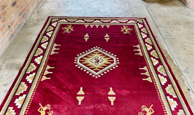 Vibrant red Southwestern area rug after professional cleaning by Bulldog Carpet Cleaning in Hunt County, TX