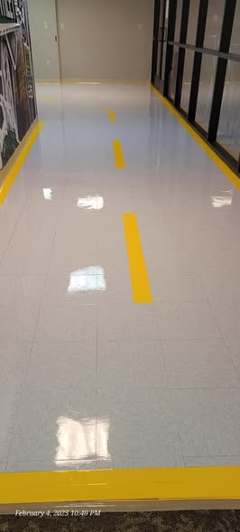 Freshly polished VCT tile hallway floor with mirror-like shine