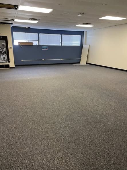 Office carpet at Quinlan ISD showing fully restored color after professional carpet cleaning